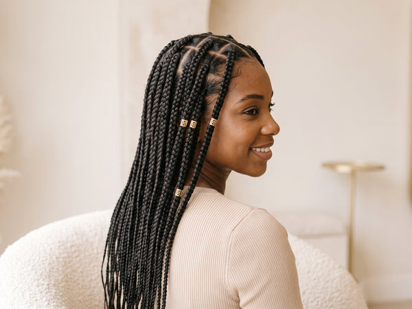 Knotless box braids with gold cuffs